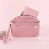 Tsuki ‘Sakura Journey’ Travel Pouch with Tsuki ‘Sakura Journey’ Limited Edition Travel Notebook and pens inside with Tsuki ‘Sakura Journey’ Vintage Journal Washi Tape Set with cherry blossoms in pink background