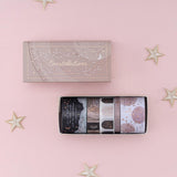 Tsuki Constellations Washi Tape Set by Notebook Therapy on pink background with star-shaped decorations around the open box