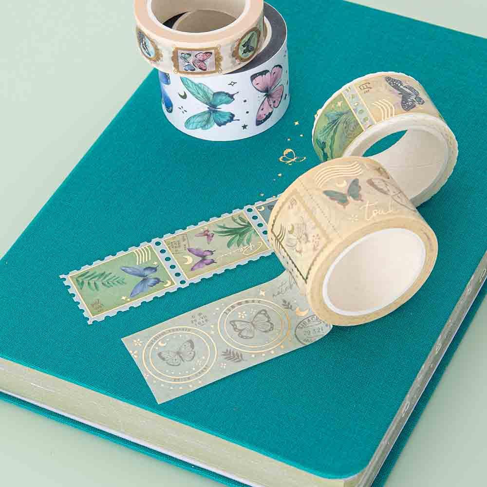 Close up of Tsuki ‘Flutter + Dream’ Washi Tape Set by Notebook Therapy x Pelinkan on Tsuki Teal Sky ‘Flutter + Dream’ Limited Edition Bullet Journal by Notebook Therapy x Pelinkan on mint background