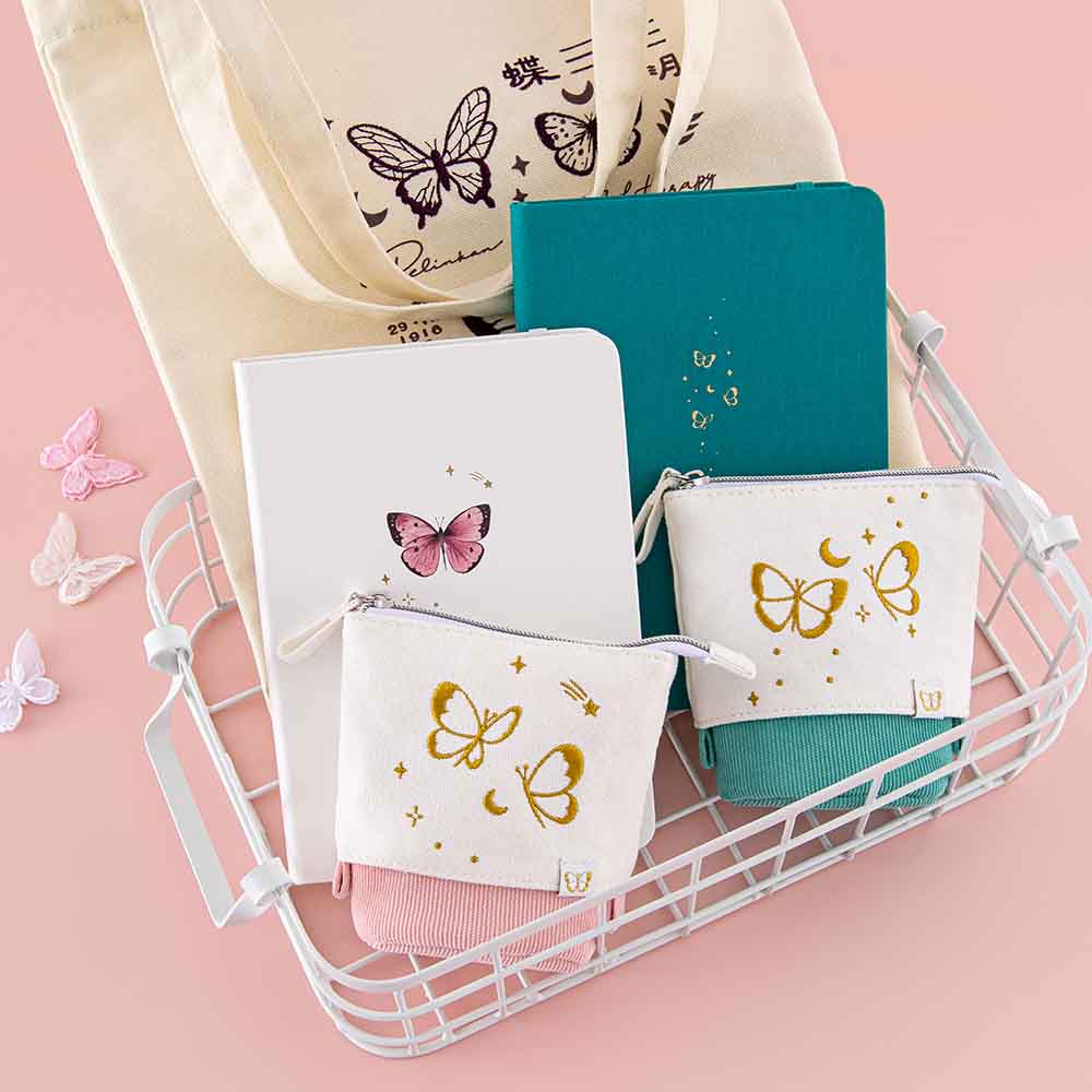 Tsuki Cloud White Sky ‘Flutter + Dream’ Limited Edition Bullet Journal by Notebook Therapy x Pelinkan and Tsuki Teal Sky ‘Flutter + Dream’ Limited Edition Bullet Journal by Notebook Therapy x Pelinkan and Tsuki ‘Flutter + Dream’ Pop-Up Pencil cases in teal and pastel pink by Notebook Therapy x Pelinkan and Tsuki ‘Flutter + Dream’ Tote Bag by Notebook Therapy x Pelinkan in white basket with butterflies in pastel pink background