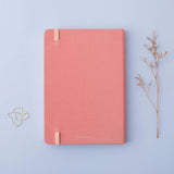 Back cover of Tsuki ‘Suzume’ Limited Edition Bullet Journal with free gift and flowers on lilac background
