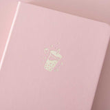 Close up of the front cover of Tsuki ‘Ichigo’ Limited Edition Boba Bullet Journal on light pink background