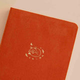 Close up of the front cover of Tsuki ‘Kitsune’ Limited Edition Fox Bullet Journal on beige background