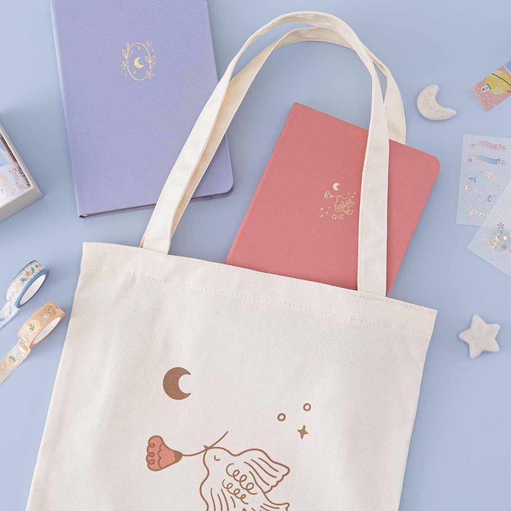 Tsuki ‘Moonflower’ Limited Edition Tote Bag with ‘Suzume’ Limited Edition Bullet Journal and ‘Full Bloom’ Limited Edition Notebook and ‘Moonflower’ Washi Tape Set with free stickers with star and moon on light blue background