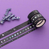 Close up of Tsuki ‘Moonlit Spell’ Washi Tape with lavender sprigs on purple background