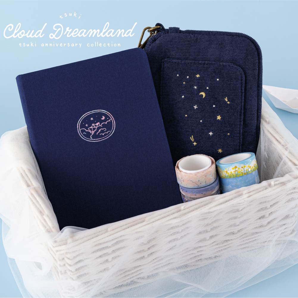Cloud Dreamland collection in a white wicker basket against blue background 