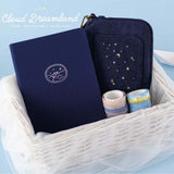 Cloud Dreamland collection in a white wicker basket against blue background 