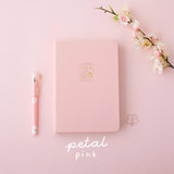 Tsuki 'Sakura' Limited Edition Bullet Journal in petal pink with bookmark gift and pink pen and flower branch on light pink background