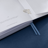 Tsuki Gentle Giant in blue background with paper clip